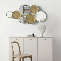 Home decoration metal wall ornaments, a mirror with multiple circular lenses, large modern wall art sculptures for decoration, suitable for living rooms, offices, and bedrooms. Dimensions: 45.3 x 1.9 x 21.6 inches. Made of gold material.